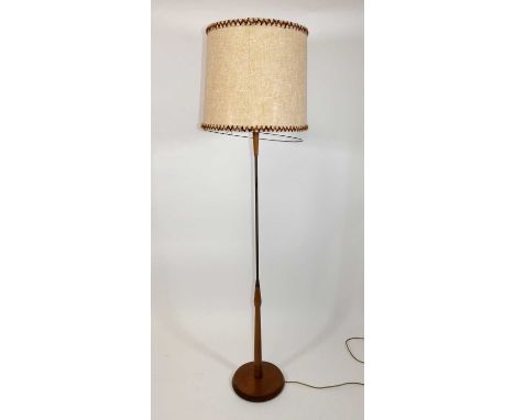 A 1960s teak and rodded tubular metal standard lamp, raised on a flattened chamfered foot, h.141cm (excluding fittings) 