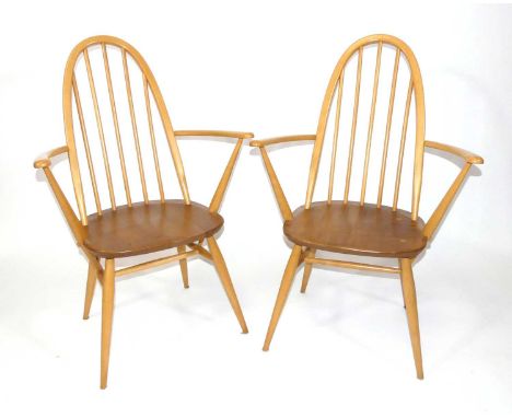 A pair of Ercol blond elm and beech 'Quaker' Model 365A elbow chairs, each w.63.5cmEach solid and useable.A few light knocks 
