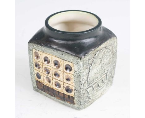 A 1970s Troika pottery squat cube vase, each side with raised, incised and relief geometric decoration, painted in tones of g