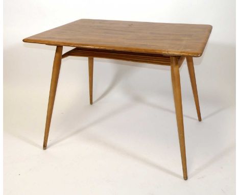 A 1960s Ercol blond elm and beech compact kitchen table, raised on turned slightly tapering supports with railed upper stretc