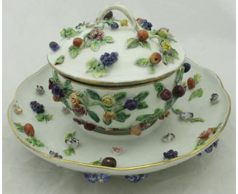 A Meissen floral and fruit encrusted bowl, cover and saucer with a white ground and bearing crossed swords mark to base CONDI