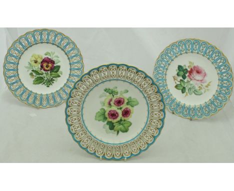 A set of five dessert plates with hand-painted floral central decoration and a pierced and shaped gilt-highlighted rim, two i