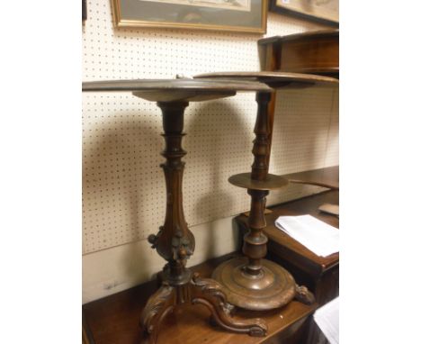 A 19th Century mahogany circular table, with column support and a small circular mid tier, on a turned base and three paw fee