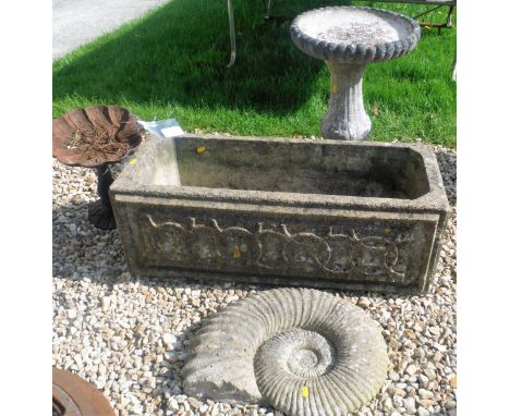 A composite stone trough with Celtic style design, a composite stone bath on pillar base, a composite stone ammonite form and