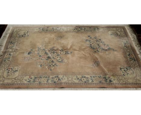 A Chinese superwash carpet with central floral medallion on a cream ground within a cream and pink floral decorated border, 2