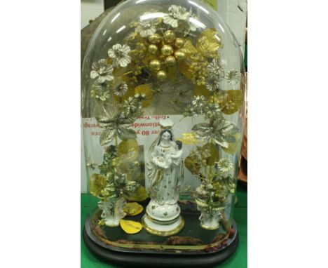 A glass dome on stand enclosing a porcelain figure of Mary with child standing beneath a floral arch CONDITION REPORTS Dome a