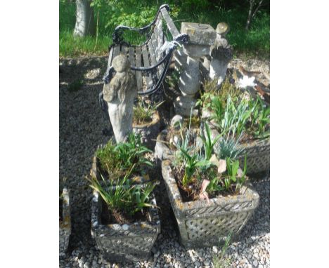 A collection of composite stone garden pots with Celtic knot style design, a sundial on a pedestal base, various figures and 