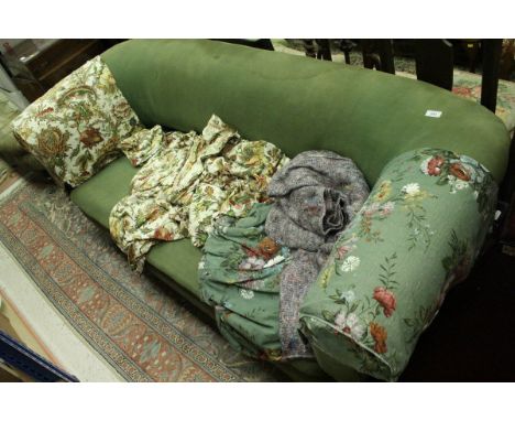 A Victorian upholstered Chesterfield scroll arm sofa on turned legs to castors