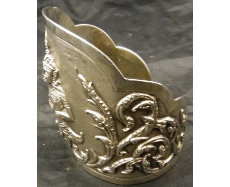 A Siamese sterling silver bangle with figural and foliate decoration, approx 2.4 ozt