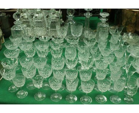 A large quantity of assorted glassware to include plated, tantalus, seven decanters, assorted wines, two champagne flutes, et