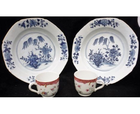 A pair of 18th Century Chinese blue and white soup plates, decorated with flowers and tree in garden setting to the centre, t