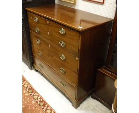 A 19th Century mahogany secretaire chest, the top drawer opening to reveal a fitted interior and fall front above three long 