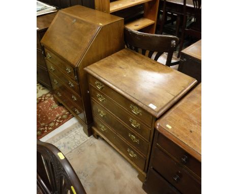 A mahogany chest of drawers, the plain top above four graduated drawers with brass handles raised on bracket feet in the 19th