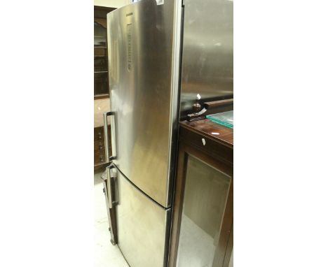 A Siemens fridge freezer CONDITION REPORTS Max height approx 169.5 cm x max width approx 60 cm.  No electical items are sold 