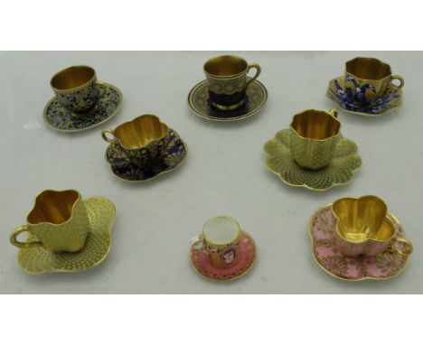 A collection of eight various miniature cabinet cups to include two Coalport, one with cobalt blue ground and gilt decoration