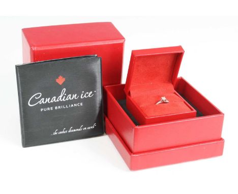An 18ct white gold diamond solitaire ring by Canadian Ice, the four-claw set princess cut diamond measuring 0.4 carats, clari
