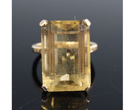 A modern 9ct gold citrine set dress ring, the emerald cut four-claw set citrine measuring 19.8 x 13.3 x 8.5mm, size N, 7.9g 