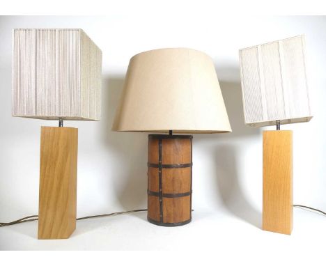 A pair of contemporary light oak table lamps, of plain rectangular form, height excluding fittings, 35cm, together with a met