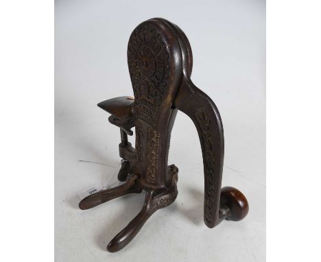 An early 20th century bar mounted mechanical corkscrew, with registration number 543083, height 24cm