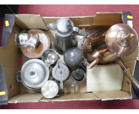 An Arts &amp; Crafts copper hot water jug, the hinged cover having a brass finial, the turned wooden handle having riveted he