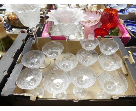A collection of Wedgwood cut glass champagne flutes; together with two art glass tea light holders 