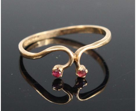 A 9ct gold ruby set band ring, sponsor JWJ, size P, 1g