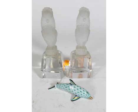 A Herend porcelain model of a dolphin hand painted in shades of green, heightened in gilt, having printed mark verso, length 