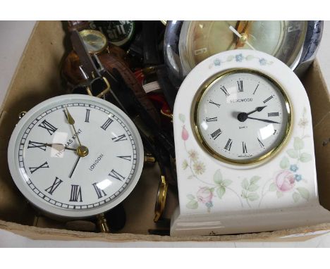 A collection of clocks and watches to include quartz wristwatches and reproduction brushed metal carriage clock