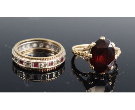 A modern 9ct gold garnet set dress ring, the oval cut garnet measuring approx 14 x 9 x 6.7mm, size L; together with a 9ct gol