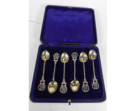 A set of six early 20th century Chinese silver,  coffee spoons, each with spiral stem and pierced terminal, in fitted leather