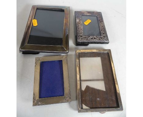 A modern Carrs of London silver clad easel photo frame of plain rectangular form, 18x13cm, together with 3 other smaller exam
