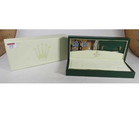A Rolex Cellini watch box, in green leather, with branded interior, together with wallet, service manual, and plastic card fo