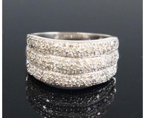 A contemporary 9ct white gold diamond half-hoop ring, arranged as three bands, each band pavé set with diamond highlights, to