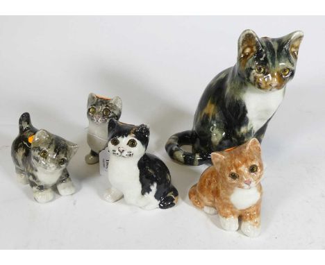 A Winstanley model of a tortoiseshell cat in seated pose, having printed Winstanley England mark verso numbered 4, height 22c