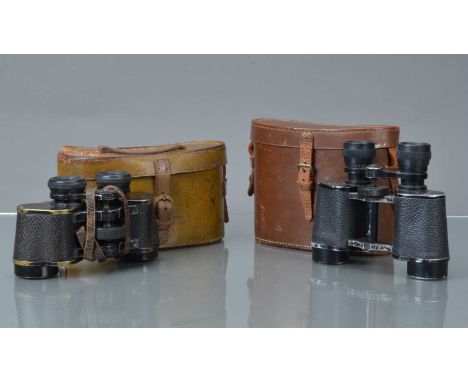 Two Pairs of Binoculars,  a pair of Ross Stereo Prism Binoculars Power =7 Field 9½° Stepnada, marked with broad arrow, body F
