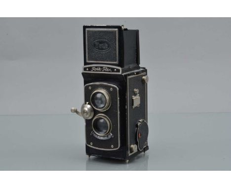 A Foth Flex II TLR Camera, focal plane shutter working, self timer runs, not working, body G, with 75mm f/3.5 lens, elements 