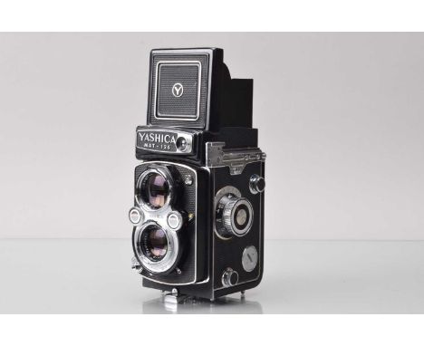 A Yashica Mat 124 TLR Camera, shutter working, meter responsive, self timer working, body G,  with Yashinon 80mm f/3.5 lens, 