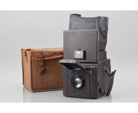A Houghton Butcher Popular Pressman Reflex Camera,  shutter working, some creasing to curtain, body G, some fading, light scr