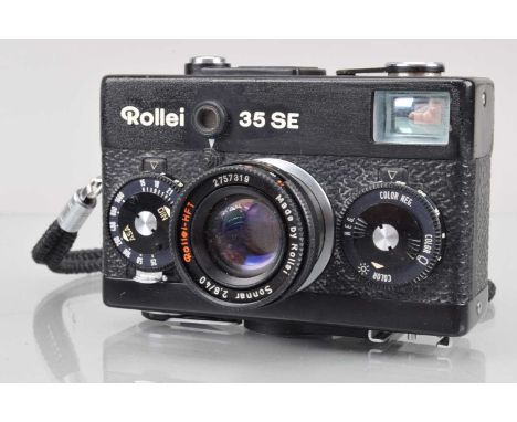 A Rollei 35 SE Compact Camera, black, made in Singapore, shutter working, meter responsive, body G, some brassing to winder e