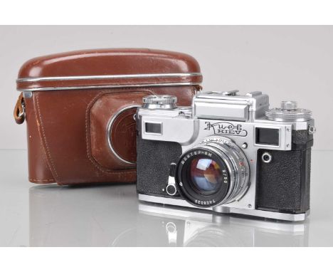A Kiev 4 Rangefinder Camera, shutter working, light cell responsive, self timer working, rangefinder working, body G, with Ju
