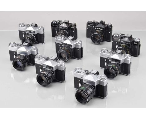 A Tray of Zenit SLR Cameras, two Zenit B, three Zenit E, two with responsive light cells, three Zenit EM, two black, light ce