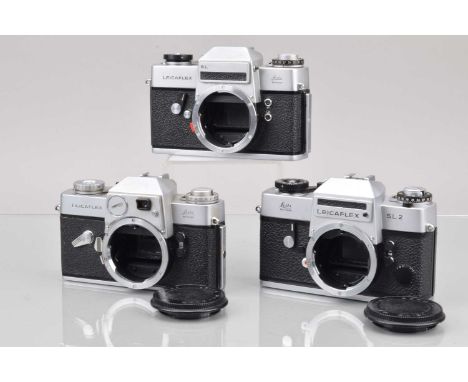 Three Leitz Wetzlar Leicaflex SLR Camera bodies,  a Leicaflex SL2, shutter working, meter responsive, self timer working. bod