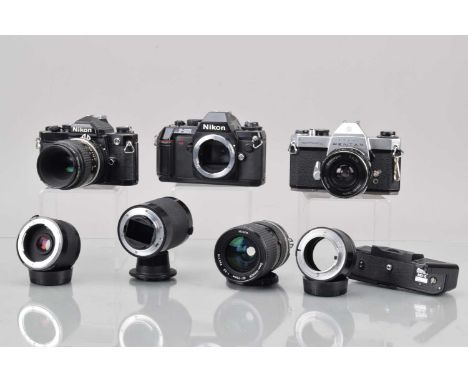 Three SLR Cameras, a Nikon FM, black, shutter working, meter responsive, self timer working, body G, some brassing to edges, 