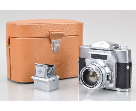An Agfa Ambiflex SLR Camera, shutter working, light cell responsive, body G, some paint wear to film door edges. With 35mm f/