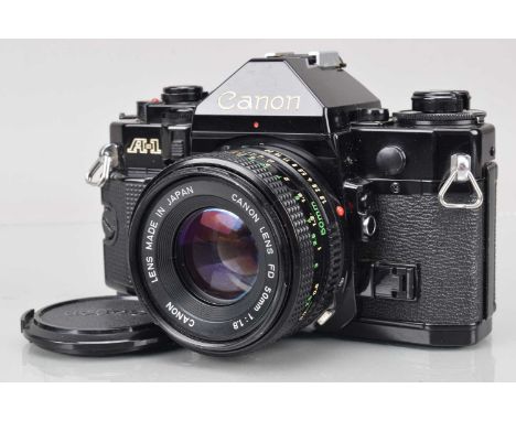 A Canon A-1 SLR Camera, black, shutter working (with squeak), meter responsive, responsive in auto, self timer working, body 