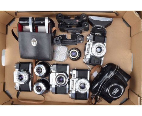 A Group of Zeiss Ikon Contaflex SLR Cameras, two Super B, one showing wear, shutters working, meters untested, with 59mm f/2.