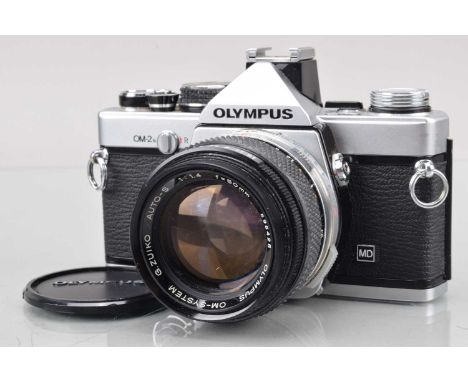 An Olympus OM-2n SLR Camera, shutter working, meter responsive, responsive in auto, self timer working body G, film advance l