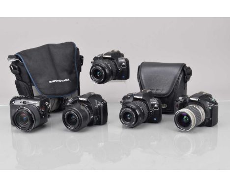 Group of DSLR Cameras, an Olympus E-410, E-420, with Zuiko Digital 7.5-45mm f/3.5-5.6 lens, power up, shutters working, menu 