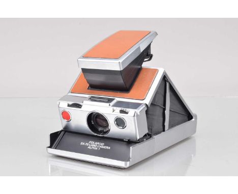 A Polaroid SX-70 Alpha 1 Camera, tan, untested, body G-VG, some marks to top, elements G-VG