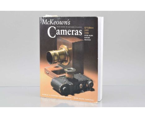 a paper back copy of the 12th Edition 2005-2006 McKeown's Price Guide to Antique & Classic Cameras,  G, light grime to outer 
